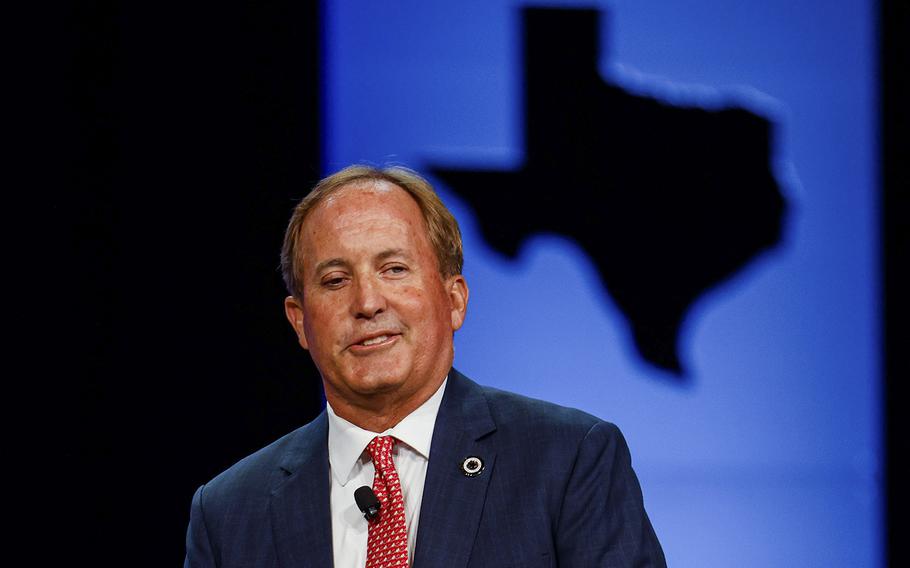Texas Attorney General Ken Paxton, speaking at the Republican Party of Texas state convention in Houston on June 17, 2022, faces two lawsuits questioning his actions as a lawyer and a boss. Private attorneys from three firms are defending his actions in both cases and have billed more than $500,000 for their work.