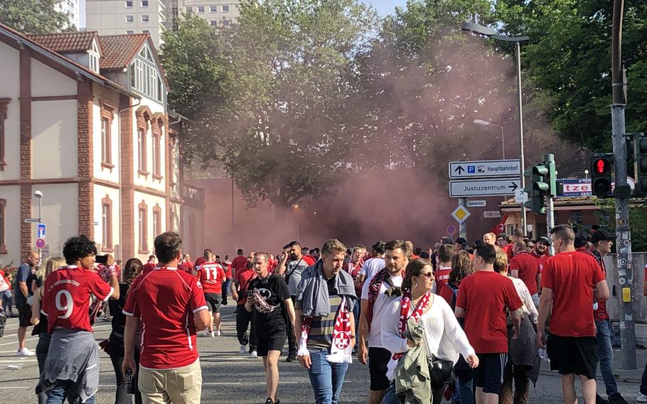 Soccer fans make their way to Fritz-Walter-Stadion in Kaiserslautern to see a championship FC Kaiserslautern game in April 2022.