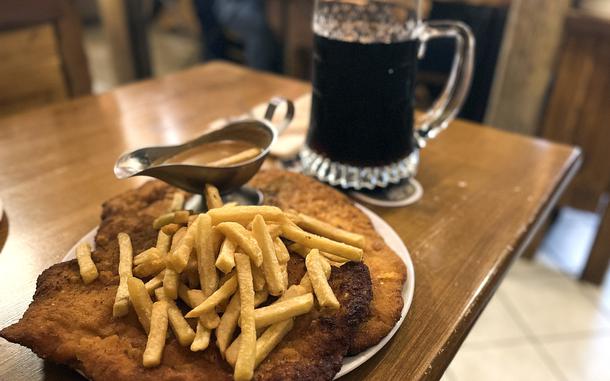 The over 2-pound Madagascar schnitzel occupies nearly half the width of a table at XXL Restaurant Waldgeist Hofheim, Germany on March 18, 2024. 