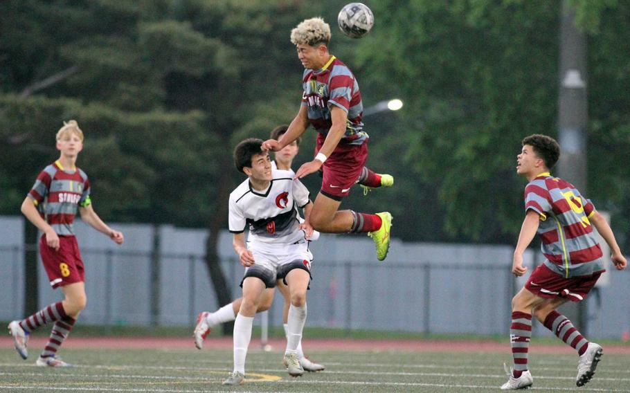 Perry's Ren Spinosi goes up to head the ball over King's Nolan Grubb.
