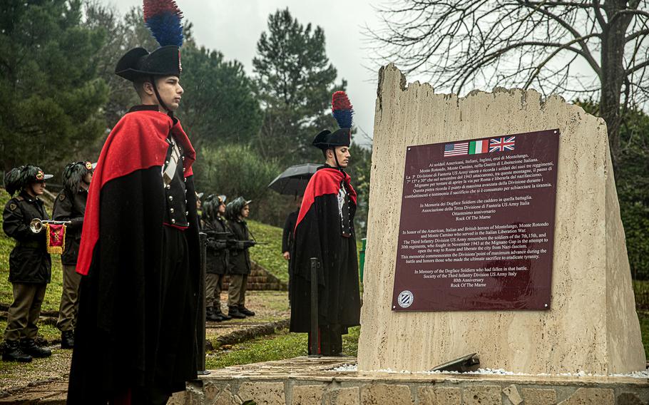 Italian soldiers render honors to 3rd Infantry Division soldiers during the inauguration ceremony for a monument dedicated to the division in Mignano Montelungo, Italy, Tuesday, March 26, 2024.