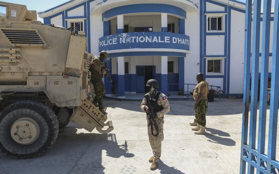FILE - Haitian and Kenyan police who are part of a UN-backed multinational force stand at a police station in Pont-Sonde, Haiti, Oct. 7, 2024, days after a gang attacked the town. (AP Photo/Odelyn Joseph, File)