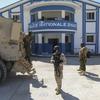 FILE - Haitian and Kenyan police who are part of a UN-backed multinational force stand at a police station in Pont-Sonde, Haiti, Oct. 7, 2024, days after a gang attacked the town. (AP Photo/Odelyn Joseph, File)