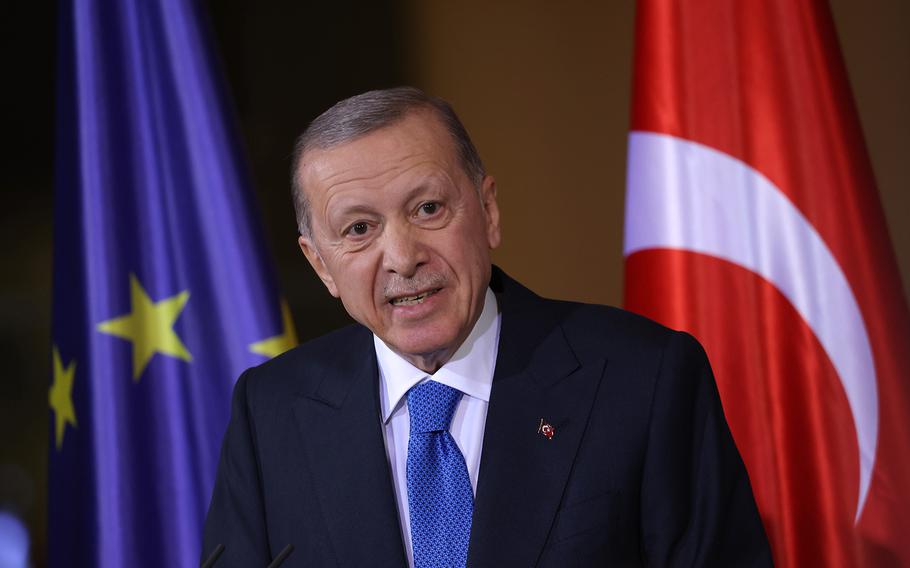 Turkish President Recep Tayyip Erdogan speaks to the media as he stands in front of a flag of the European Union before talks with German Chancellor Olaf Scholz at the Chancellery on Nov. 17, 2023, in Berlin, Germany.