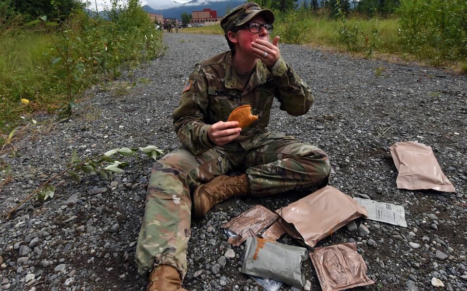 U.S. Army Sgt. Jess Flores has a Meal, Ready to Eat in between grading soldiers in a competition in 2018 at Joint Base Elmendorf-Richardson, Alaska. Eating MREs on a deployment could become a thing of the past, as the Army looks to produce food made by microorganisms.
