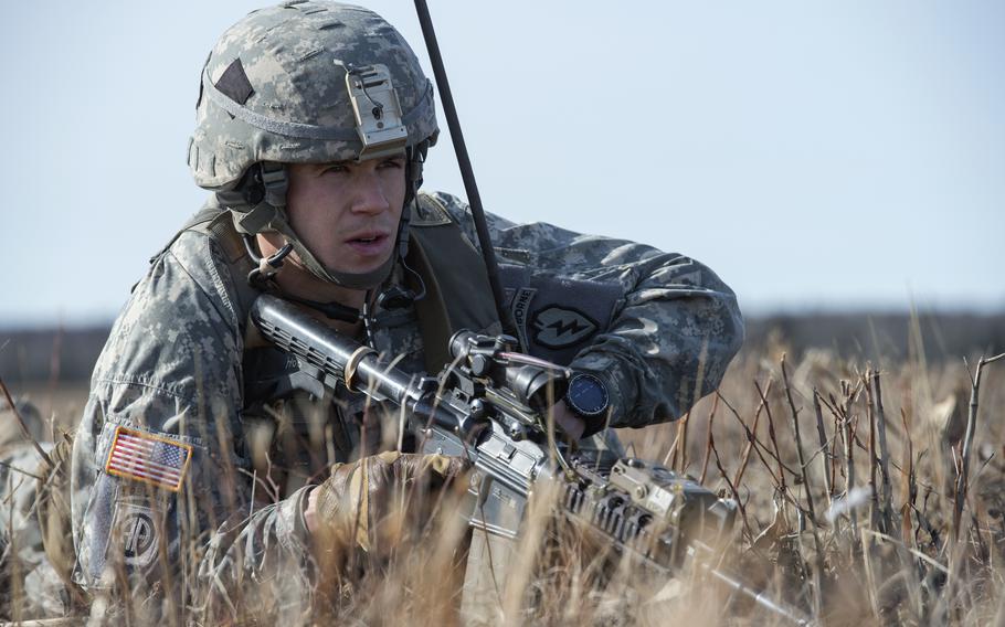 Capt. David Frost, a native of Franklin, Mass., assigned to the 4th Infantry Brigade Combat Team (Airborne), 25th Infantry Division, U.S. Army Alaska, relays information while conducting a parachute assault on Malemute drop zone at Joint Base Elmendorf-Richardson, Alaska, March 20, 2015, during Operation Spartan Valkyrie. Frost, now in the reserves, is training for the Boston Marathon and raising funds for the hospital that saved his life.
