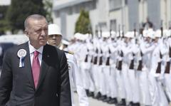 Turkey President Recep Tayyip Erdogan inspects a military honor guard during a ceremony marking the docking of a submarine, in Kocaeli, Turkey, Monday, May 23, 2022. 