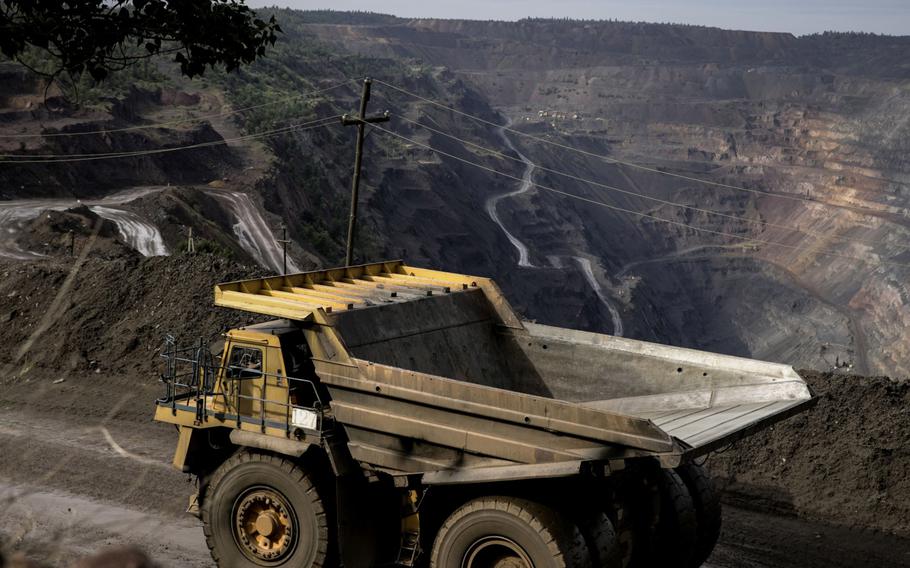 A dump truck travels along an access road to source building materials from the borrow pit of the Central Mining Enrichment Plant, operated by Metinvest Holding, in Kryvyi Rih, Ukraine, on June 30, 2022. 