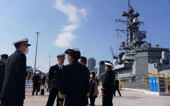 U.S. Navy and Japan Maritime Self-Defense Force sailors tourthe new Pier 5 at  Yokosuka Naval Base, Japan, on Nov. 18, 2022. 