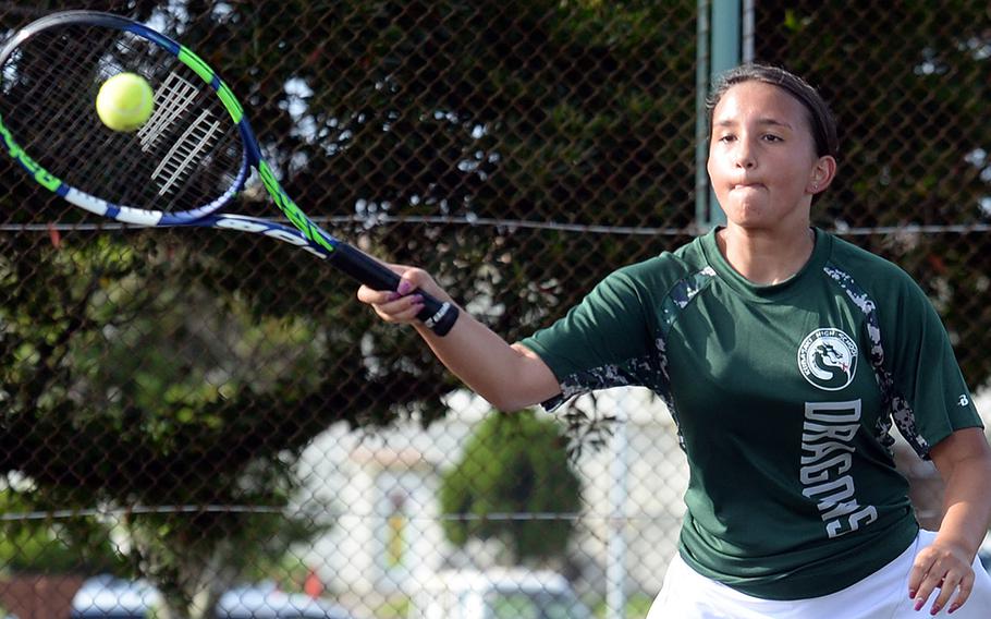 Kubasaki's Ella Perez hits a forehand return against Kadena's Christine Ryan during Thursday's Okinawa tennis matches. Ryan won 8-2.