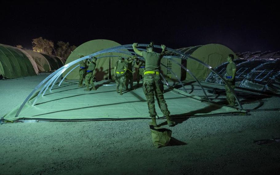 Airmen with the 635th Material Maintenance Squadron, 49th Civil Engineer Squadron, and the 49th Wing set up the foundation of a housing tent as part of Task Force-Holloman, Aug. 27, 2021, on Holloman Air Force Base, N.M.