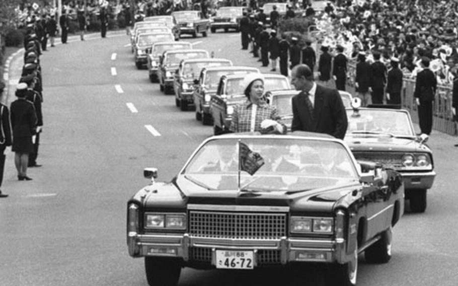 Queen Elizabeth II and Prince Philip stand in a Cadillac Eldorado convertible as they ride from Tokyo’s Imperial Hotel to the National Theatre, May 9, 1975. The vehicle was delivered to the Japanese National Police Agency just a few days prior to the visit and was reportedly bought at 7 million yen. After the Queen’s departure, the vehicle was to be used by the Japanese emperor. 