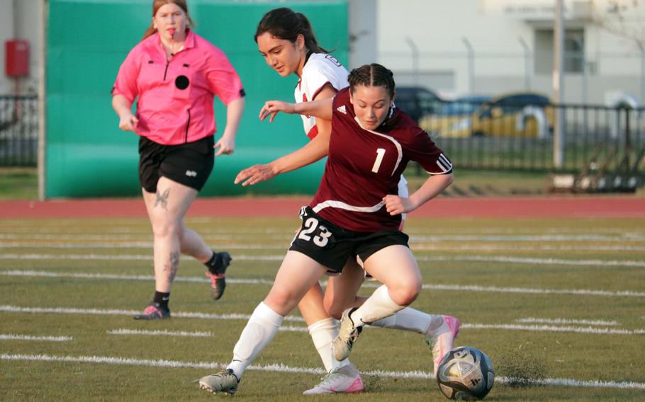 Priscilla Ramirez and Joanna Hall battle for the ball.
