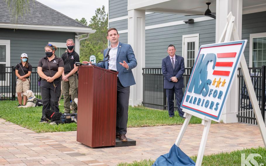 K9s for Warriors CEO Rory Diamond unveils the nonprofit's new logo during its 10-year anniversary event.