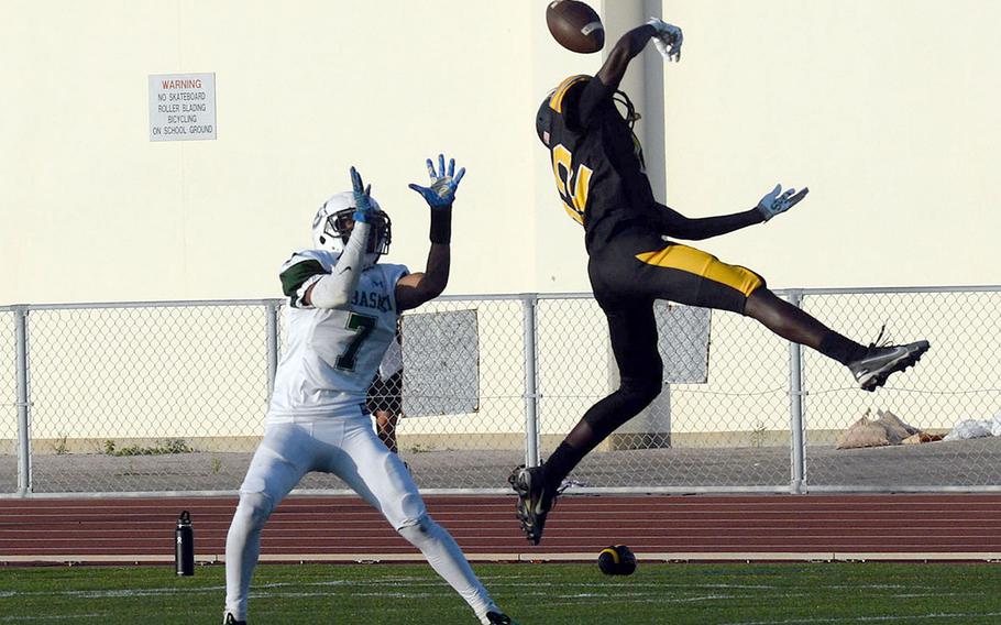 Kadena's DeShaun Nixon bats away a pass intended for Kubasaki's Onzei Weaver.
