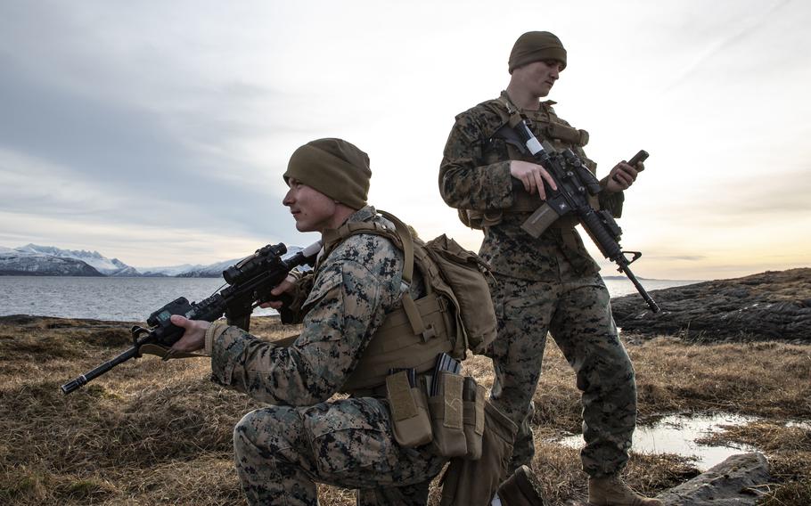 U.S. Marines Jared Curtis, left, and Dylan Shawver, both lance corporals, guard force sentries with 2nd Marine Expeditionary Support Battalion, II Marine Expeditionary Force in Bodo, Norway, on March 9, 2022, ahead of Exercise Cold Response.