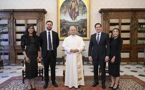 Pope Leo XIV stands for a family photo with Vice President JD Vance, second from left, his wife Usha Vance, Secretary of State Marco Rubio, second from right, and his wife Jeanette Dousdebes Rubio, on the occasion of their meeting at the Vatican, Monday, May 19, 2025. (Vatican Media via AP)