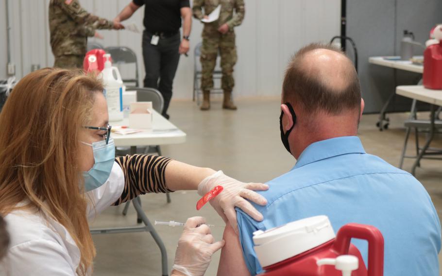 A medical provider administers a coronavirus vaccine to Brian Sipp, public affairs specialist, 1st Theater Sustainment Command, at Fort Knox, Ky., on March 11, 2021. 