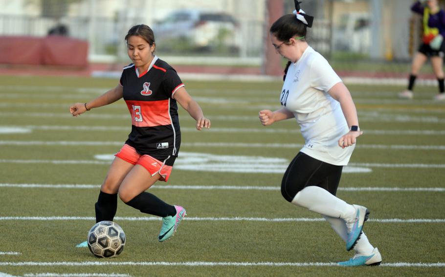 E.J. King’s Ai Kina dribbles the ball against Zama’s Bella Blowers during Friday’s DODEA-Japan girls soccer match. The Cobras won 5-0.