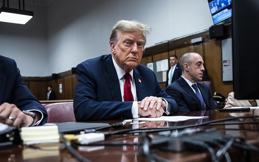 Donald Trump sits in Manhattan criminal court with his legal team on April 15, 2024. 