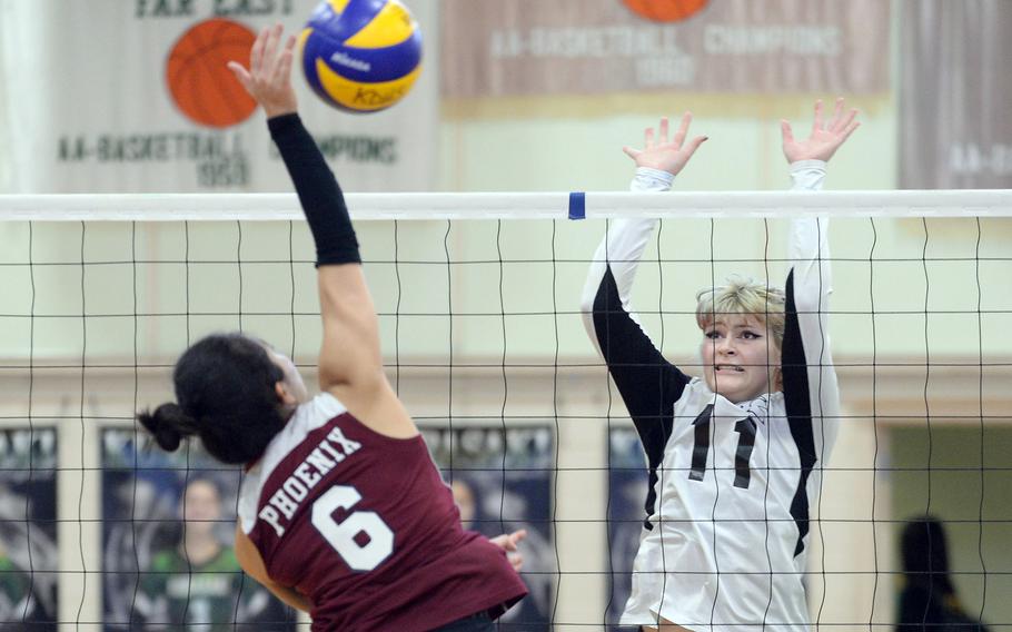 Seisen International's Ann Katashiba spikes against Zama's Kaitlynn McAbee during Thursday's pool-play match in the Ryukyu Island Tournament. The Phoenix won in straight sets.