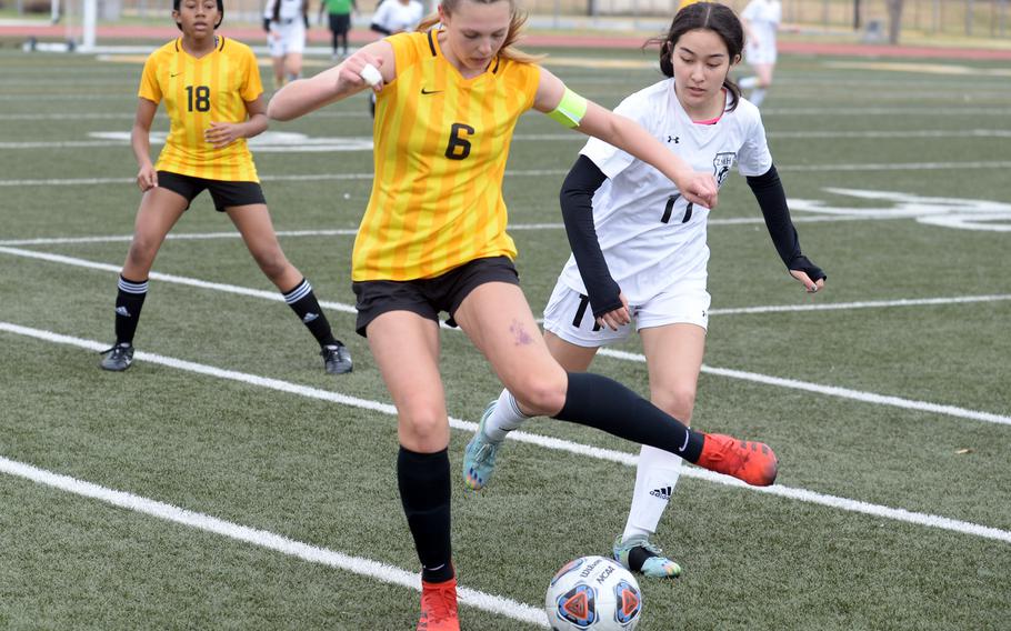 Robert D. Edgren’s Karin Lozier tries to keep the ball away from Zama’s Lindsay So during Saturday’s DODEA-Japan girls soccer match. The Eagles rallied to win 3-2.