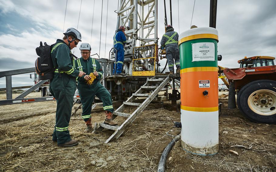 Workers associated with the Well Done Foundation plug an abandoned oil well in rural Toole County, north of Shelby, Mont. 