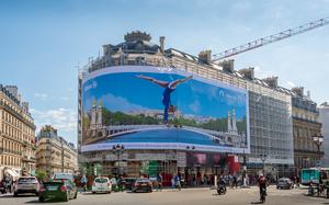 A billboard in Paris reminds passersby that the Olympic summer games come to town in July. 