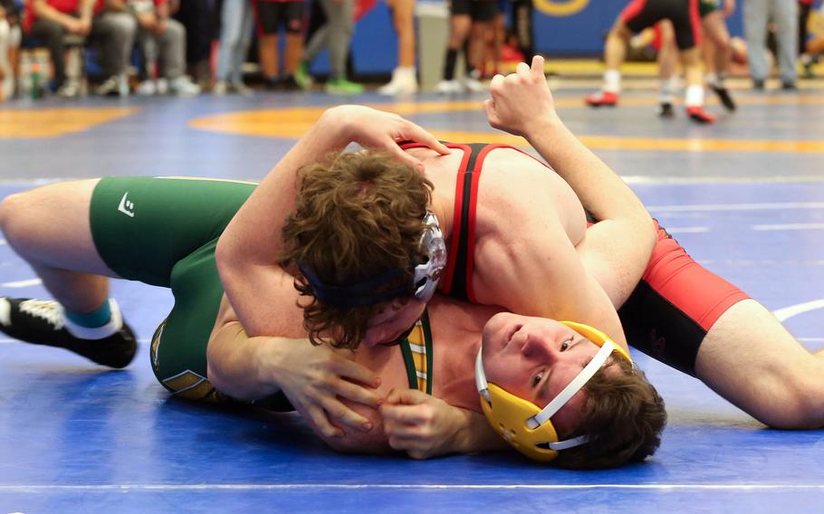 Nile C. Kinnick's Jacob Gillbrech pins Robert D. Edgren's Titus Tungett in the 172-pound final during Saturday's Yokota wrestling tournament.