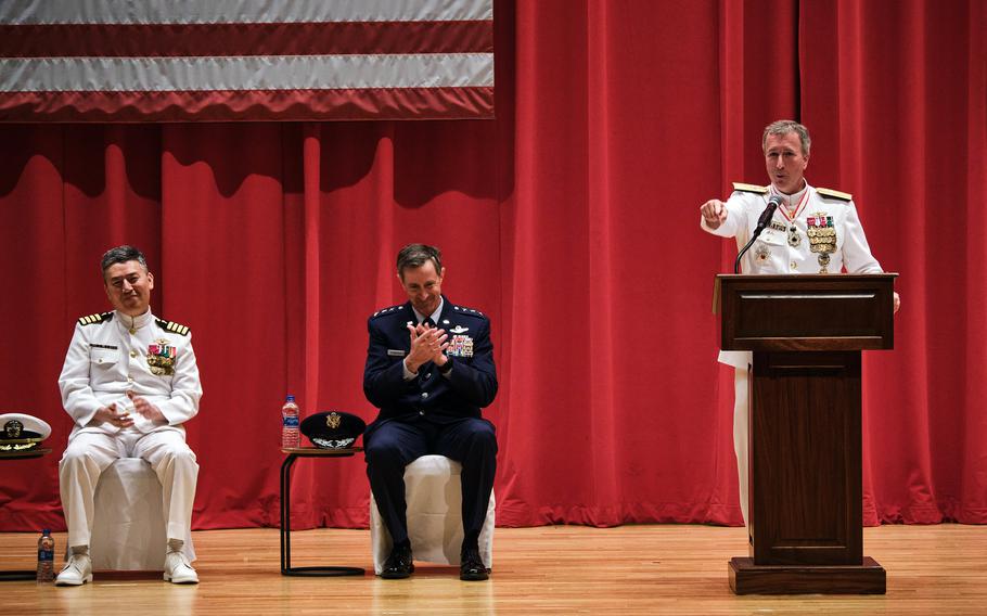 Rear Adm. Brian Fort speaks after handing command of U.S. Naval Forces Japan and Navy Region Japan to Rear Adm. Carl Lahti, far left, at Yokosuka Naval Base, Japan, Wednesday, July 14, 2021. 