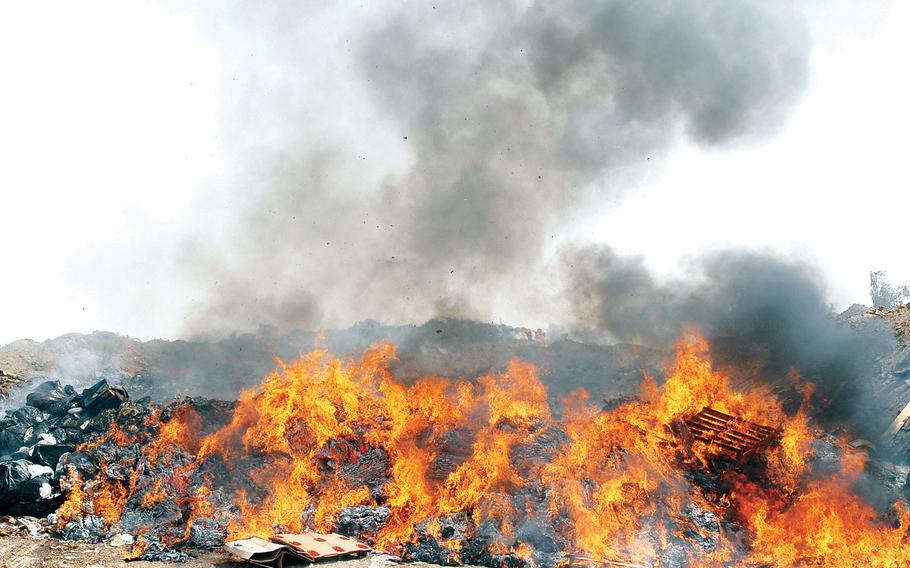 The burn pit at Balad Air Base, Iraq, in 2008. Long deployments to military bases with open-air burn pits put veterans of the wars in Iraq and Afghanistan at higher risk for certain respiratory ailments, according to new research that used recently declassified deployment data.