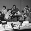 Hed: Ramen break on the City Desk, 1955

Tokyo, Japan, Sometime in 1955 (probably): To celebrate Stars and Stripes Pacific's 80 anniversary, we're showing some of the many images we have of the people who made those first few decades possible (and tasty!). 

Stars and Stripes Pacific holds many images of personnel and its operations in their archives, but few have the exact date noted, so the year this photo was actual taken is unknown. 

From left to right: Glenn Pratt (1955-?, reporter), Richard "Dick" H. Larsh (1946-1958, 1961-1967; ESS 1958-1961, feature editor). Background - Al Ricketts (1952-1968, entertainment editor), Hank Simons (1955-1957, reporter and photographer), and Alvin Moore (1955-?, artist). 

Check out Stars and Stripes Pacific's special 80th anniversary section here.
https://80.stripes.com/80th-home

META TAGS: SSP 80th anniversary; Stars and Stripes history; Stars and Stripes personnel; newspaper; newsroom; Japanese food; Japanese cuisine; journalists; journalism; typewriter; chopsticks