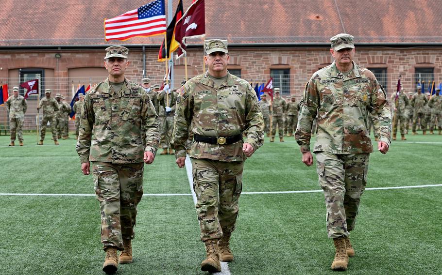 Three soldiers walk. 