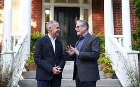 Carney greets Starmer on the steps.