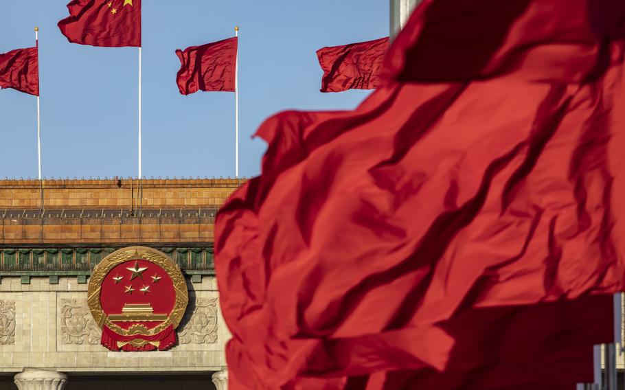 Chinese national flags fly over Tiananmen Square along with other red flags ahead of the fifth plenary session of the First Session of the 14th National People’s Congress (NPC) at the Great Hall of the People in Beijing, China, on Sunday, March 12, 2023. China reappointed several top economic officials in a leadership reshuffle Sunday, giving investors greater continuity as Beijing overhauls financial regulation and grapples with escalating tensions with the US. 