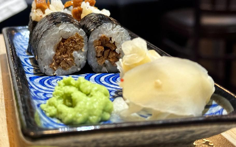Vegetarian sushi on a plate, ready to eat at a Japanese restaurant.