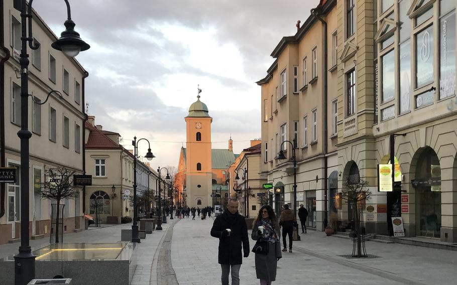 People walk down 3 Maja, a shop-lined street in Rzeszow, Poland, in February 2022. None of the roughly 1,500 American service members and civilians supporting U.S. operations in southeastern Poland have been affected by an outbreak of Legionnaires’ disease, according to the U.S. military.