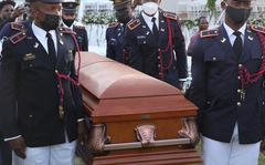 Soldiers of the Armed Forces of Haiti carry the casket of slain President Jovenel Moïse before his funeral on July 23, 2021, in Cap-Haitien, Haiti. Moïse, 53, was shot dead in his home in the early hours of July 7. (Valerie Baeriswyl/AFP/Getty Images/TNS)