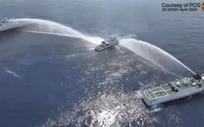 In this image made from video provided by the Philippine Coast Guard, Philippine Coast Guard vessel, BRP BAGACAY (MRRV-4410) is water cannoned by Chinese Coast Guards as it tried to approach the waters near Scarborough Shoal locally known as Bajo De Masinloc at the South China Sea on Tuesday April 30, 2024. 