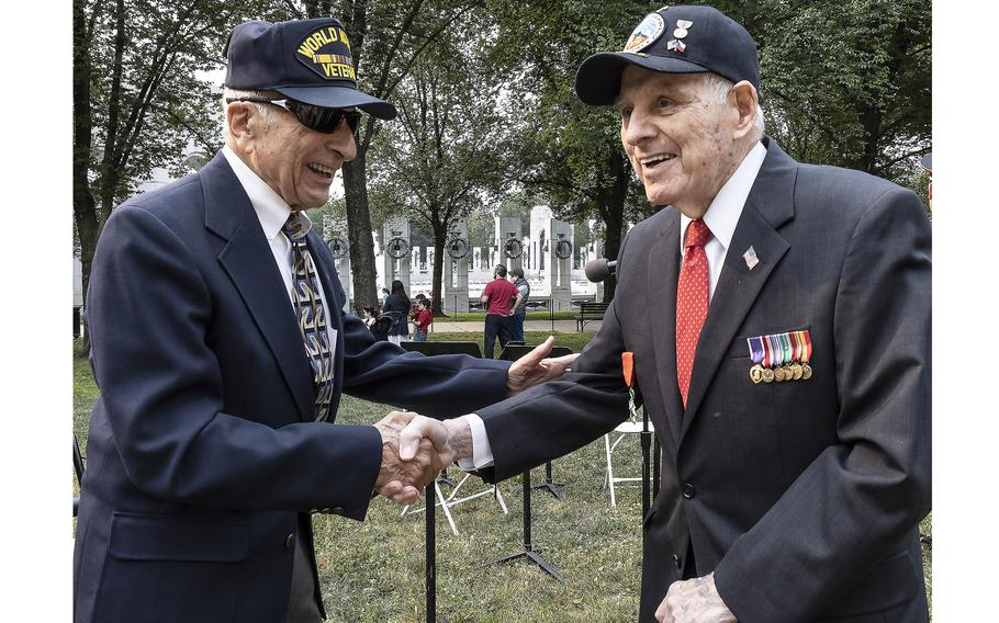 sample remembrance day speech World War II veterans Frank Cohn, left, and Lincoln Harner shake hands at the National World War II Memorial in Washington, D.C., on the 79th anniversary of the start of the D-Day invasion, Tuesday, June 6, 2023.