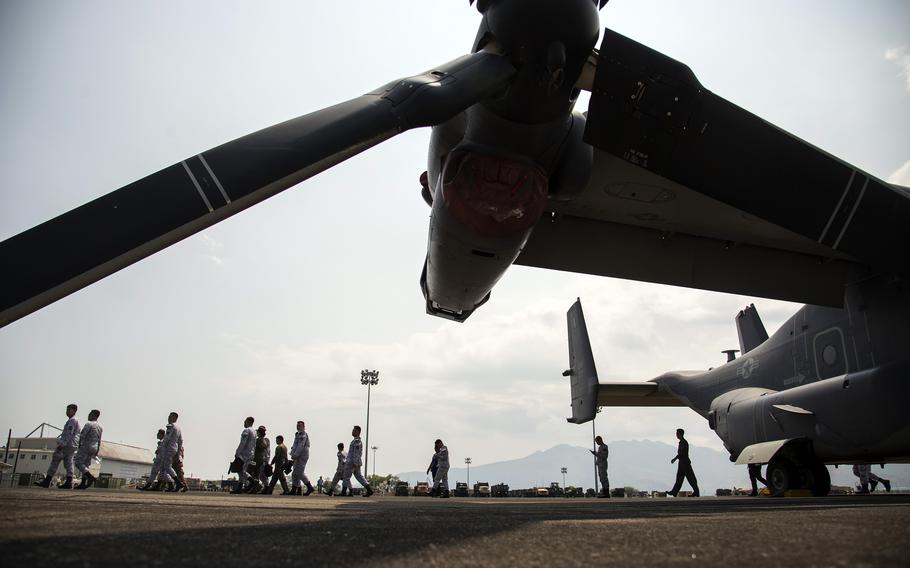 Philippine navy sailors finish their tour of an Air Force CV-22 Osprey during a Balikatan drill at the former home of Naval Air Station Cubi Point, Sunday, April 23, 2023. 