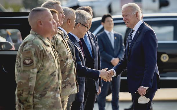 President Joe Biden greets leaders of South Korea and the 51st Fighter Wing at Osan Air Base, South Korea, upon his arrival May 20, 2022.