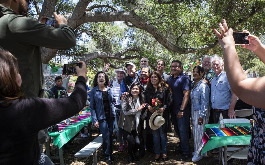 Members of the support group "Team Juana" gather around Juana Flores and her husband, Andres, at a park in Santa Barbara, Calif., on June 6. 