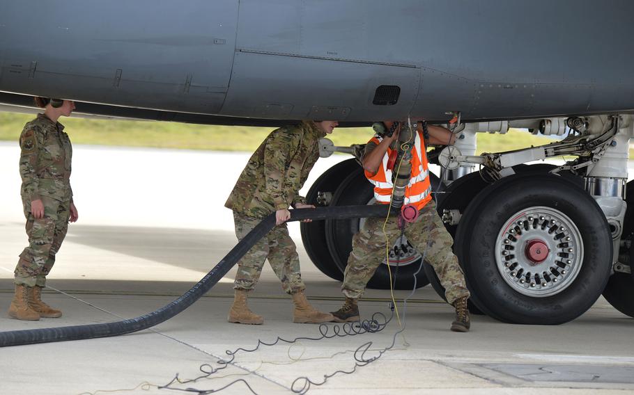 Airmen refuel a B-1B Lancer at Spangdahlem Air Base, Germany, Oct. 11, 2021. A pair, from the 9th Expeditionary Bomb Squadron, Dyess Air Force Base, Texas, refueled at Spangdahlem, using the Versatile Integrating Partner Equipment Refueling kit to take on fuel.