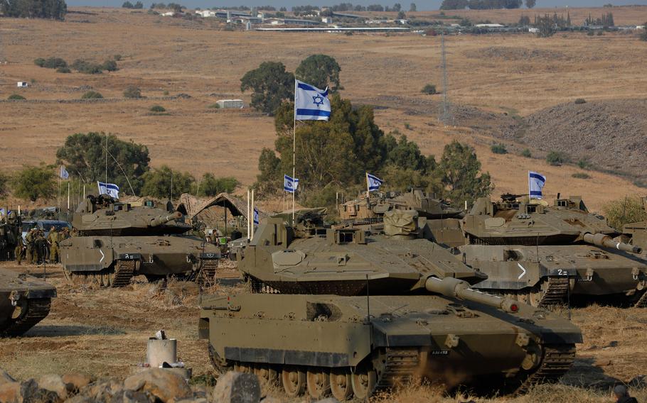 Israeli Merkava tanks are positioned in the upper Galilee in northern Israel near the border with Lebanon on Oct. 11, 2023. Israel appeared to be readying for a possible ground invasion of Gaza, but faces the threat of a multi-front war after also coming under rocket attack from militant groups in neighboring Lebanon and Syria.