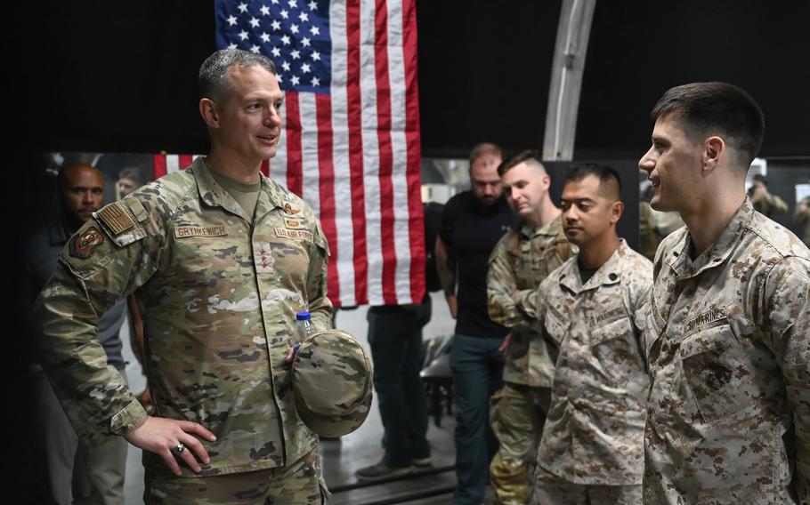 Air Force Lt. Gen. Alexus Grynkewich, commander of U.S. Air Forces Central, speaks with Marines at Al Dhafra Air Base in the United Arab Emirates on May 3, 2023.  Russian fighter jets and surveillance drones have been regularly flying above U.S. positions in Syria and sometimes have attempted to goad American pilots into dogfights, Grynkewich has said.