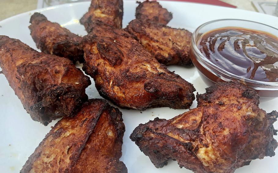 A serving of chicken wings with barbecue sauce as served at Piazza in Griesheim, Germany. The wings were crisp and juicy, while the sauce was sweet and tangy.