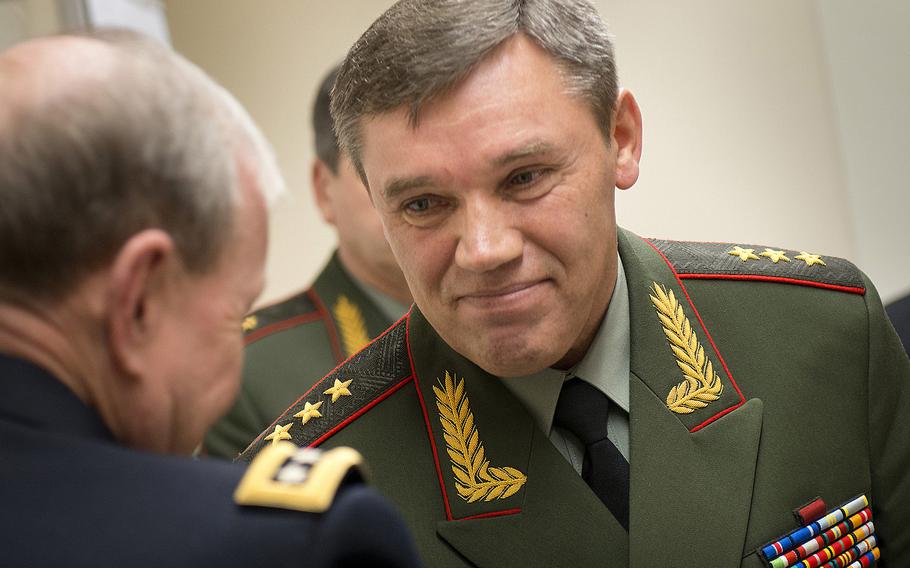 Former Chairman of the Joint Chiefs of Staff U.S. Army Gen Martin E. Dempsey, left, and Chief of the General Staff of the Russian Armed Forces Gen. Valery Gerasimov meet Jan. 16, 2013, at NATO Headquarters in Brussels. Wagner mercenary group leader Yevgeny Prigozhin is trying to force the latter to resign after Russian forces suffered humiliating retreats and huge battlefield losses in the war against Ukraine.