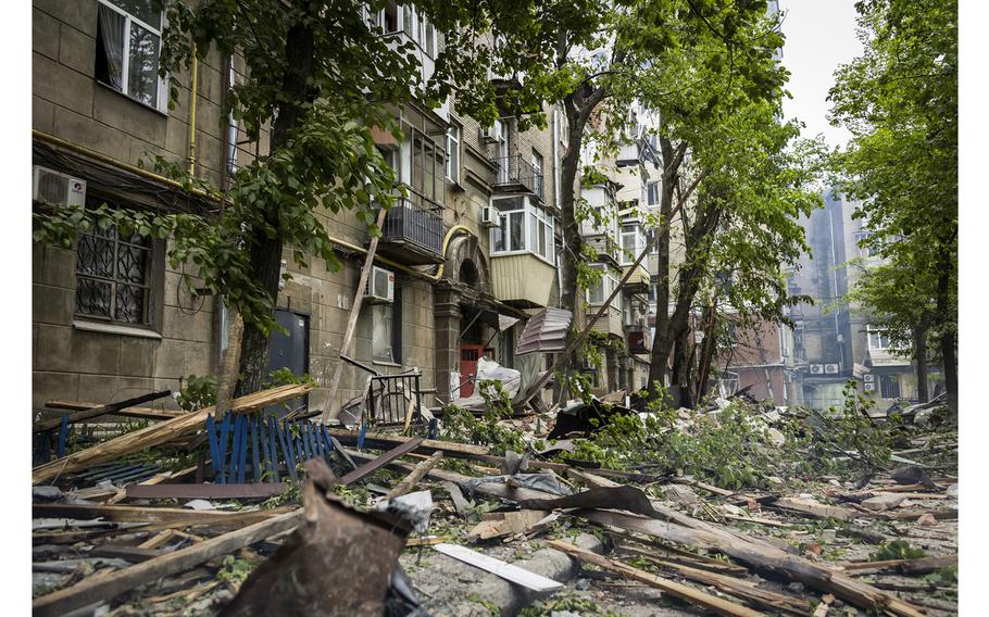 Debris clutters the ground after a Russian attack on a residential building in Dnipro, Ukraine, on Friday, April 19, 2024. 