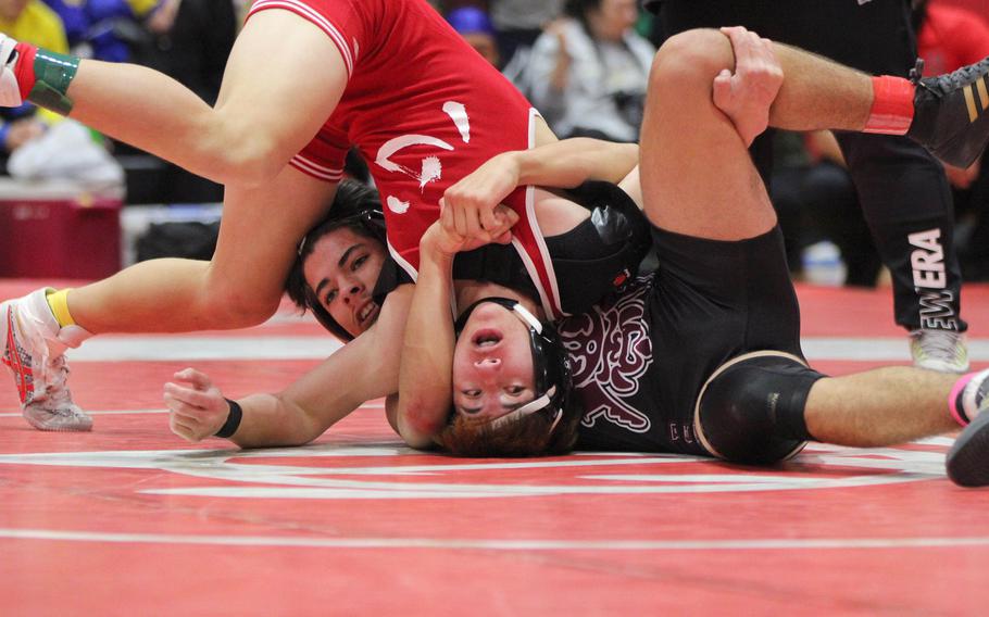 Matthew C. Perry's Jaden Valverde-Barrantes turns Nile C. Kinnick's Ethan McDaneil upside down at 145 pounds.